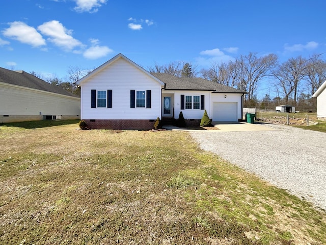 ranch-style home with a garage, crawl space, a front lawn, and gravel driveway