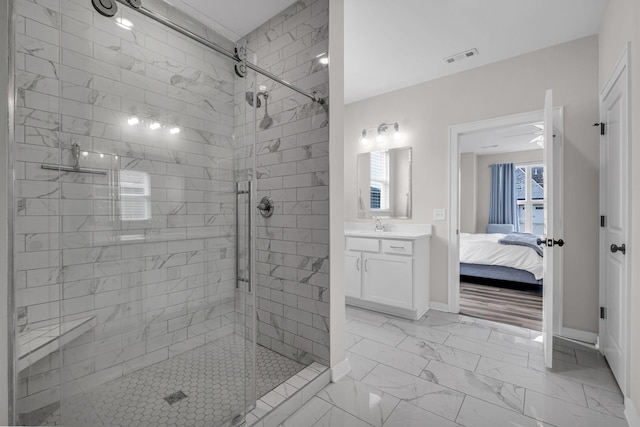 full bathroom with marble finish floor, visible vents, ensuite bathroom, a stall shower, and vanity