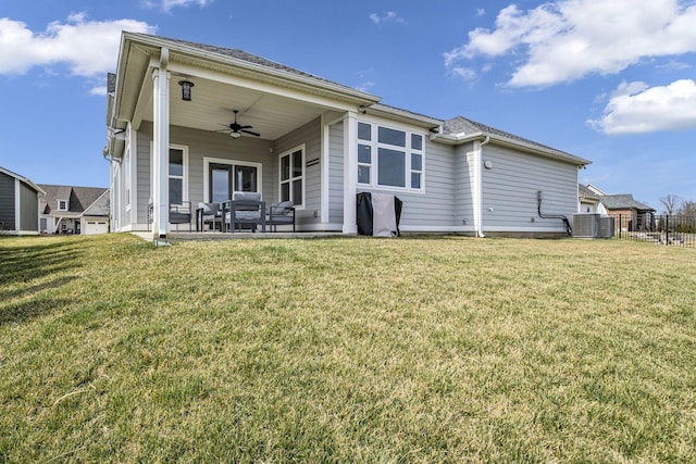 back of house with central AC unit, a patio, ceiling fan, fence, and a yard