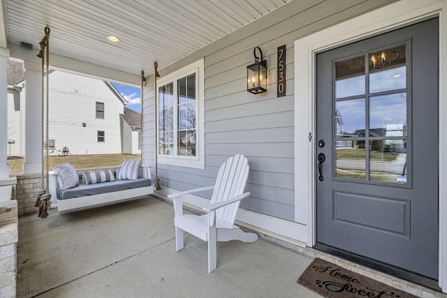 property entrance featuring a porch