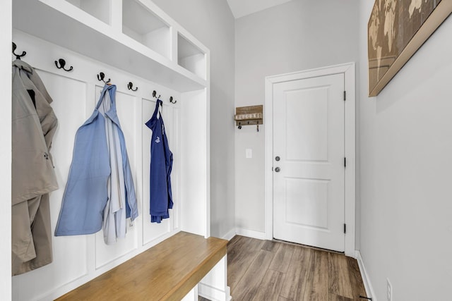 mudroom with baseboards and wood finished floors