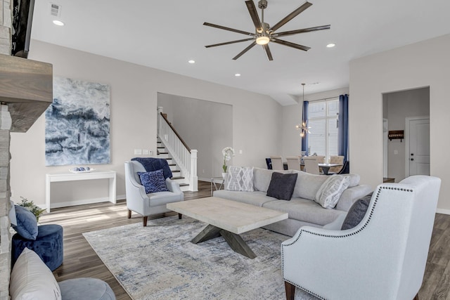 living room with visible vents, wood finished floors, and recessed lighting