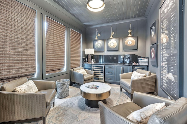 living area featuring a dry bar, wooden ceiling, beverage cooler, and crown molding