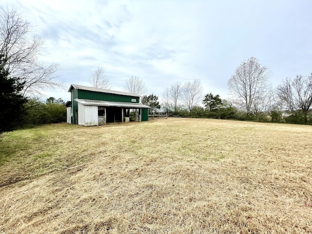 view of yard featuring an outbuilding and a pole building