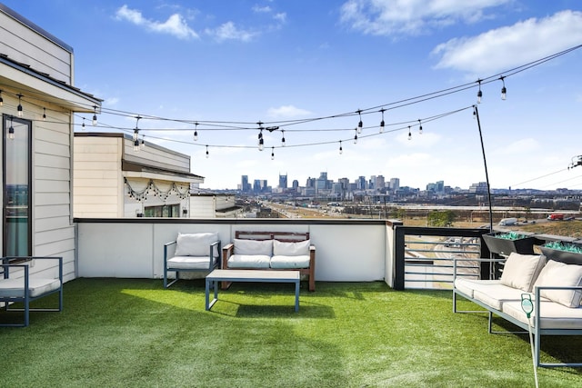 balcony featuring a view of city and outdoor lounge area