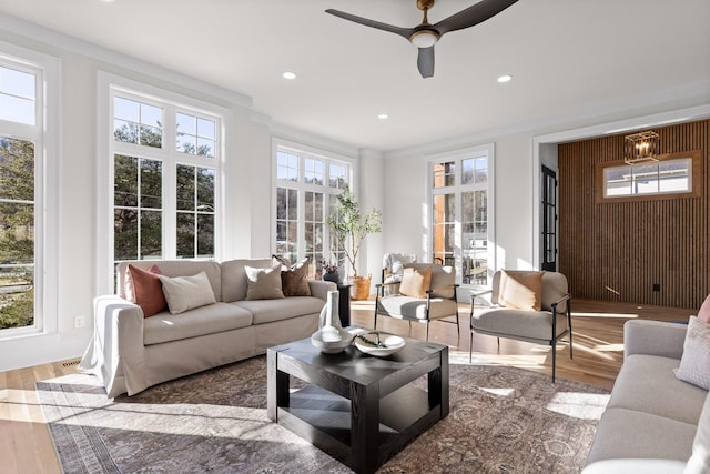 living room with ceiling fan, wood finished floors, and recessed lighting