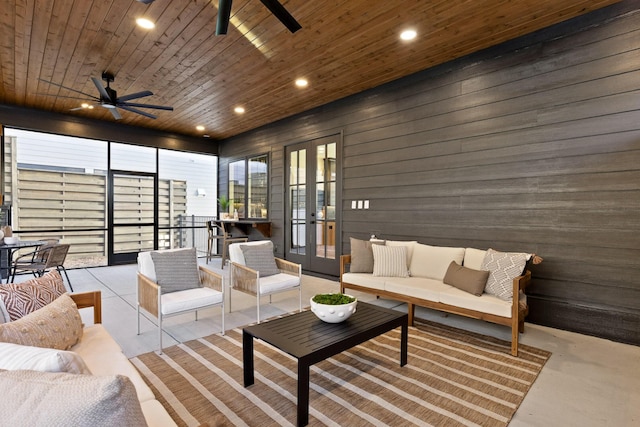 living room with wooden ceiling, ceiling fan, french doors, wood walls, and recessed lighting