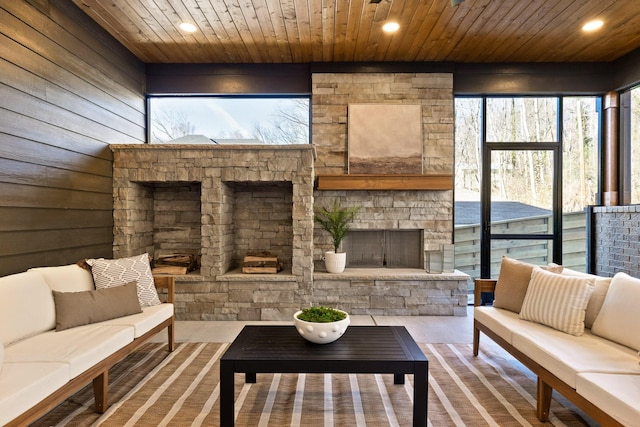 interior space with wood walls, wood ceiling, and recessed lighting