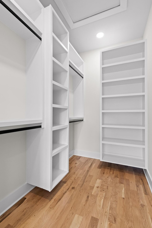 spacious closet with wood finished floors