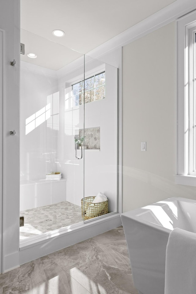 full bath featuring a stall shower, marble finish floor, a bathing tub, and recessed lighting