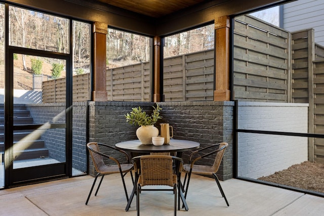 sunroom with wooden ceiling