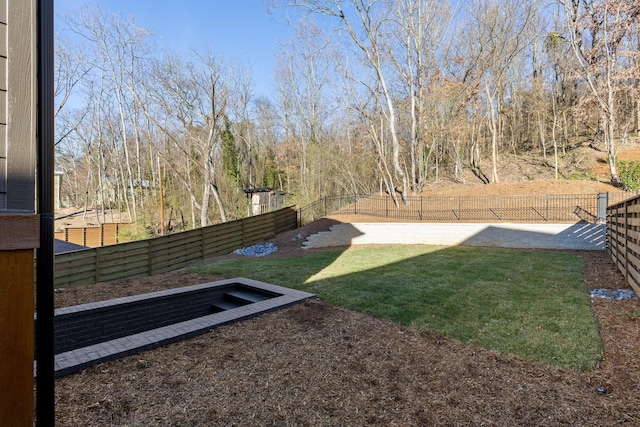 view of yard with a fenced backyard