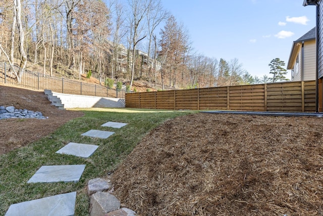 view of yard with a fenced backyard