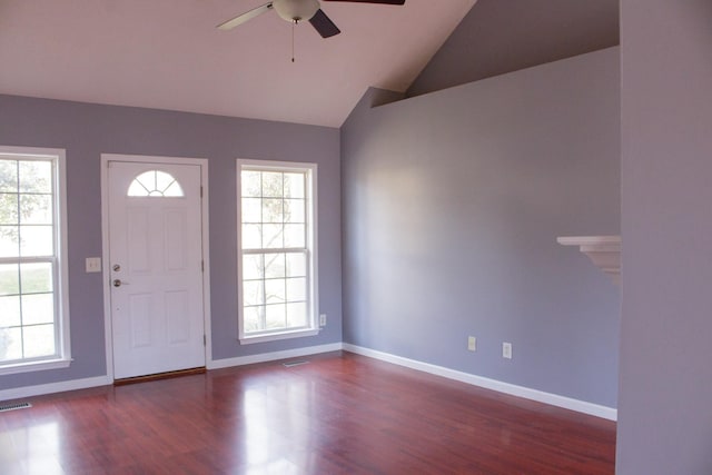 foyer entrance featuring wood finished floors, visible vents, a ceiling fan, vaulted ceiling, and baseboards