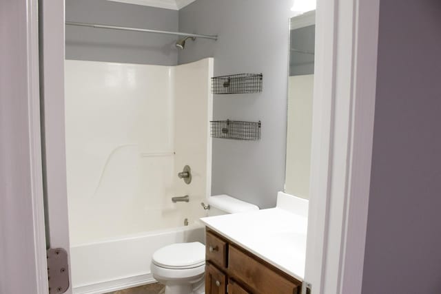 bathroom with shower / bathing tub combination, vanity, and toilet