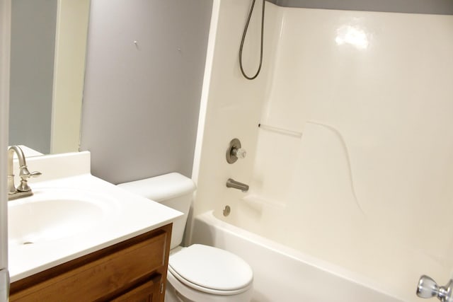 full bath featuring toilet, shower / bathtub combination, and vanity