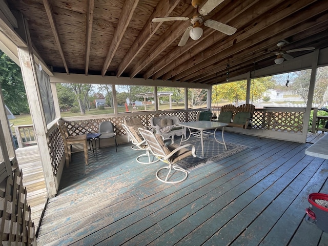 wooden deck with ceiling fan and outdoor dining space