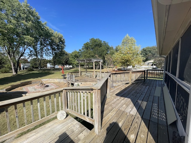 wooden terrace featuring a fire pit