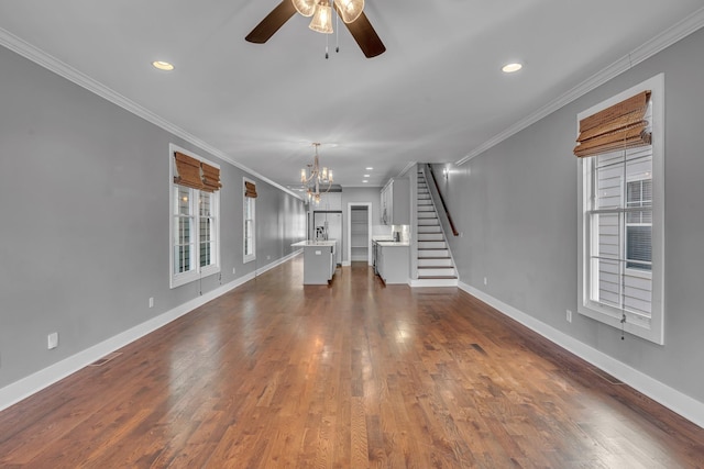 unfurnished living room featuring stairs, dark wood-type flooring, baseboards, and crown molding