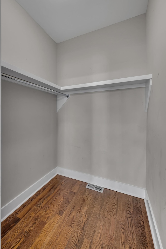 spacious closet with visible vents and wood finished floors