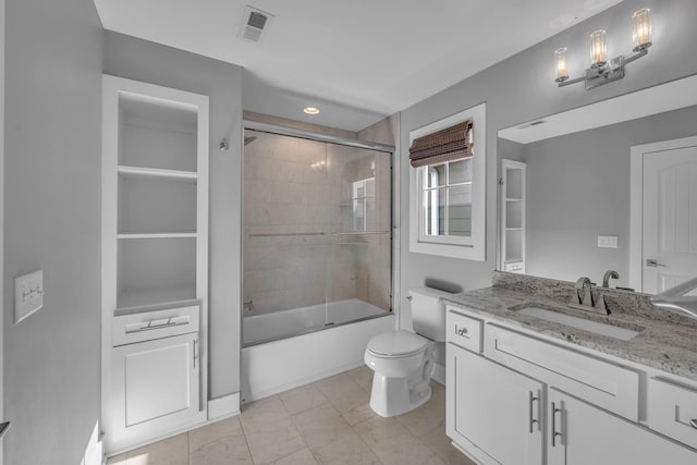 bathroom featuring marble finish floor, visible vents, toilet, enclosed tub / shower combo, and vanity