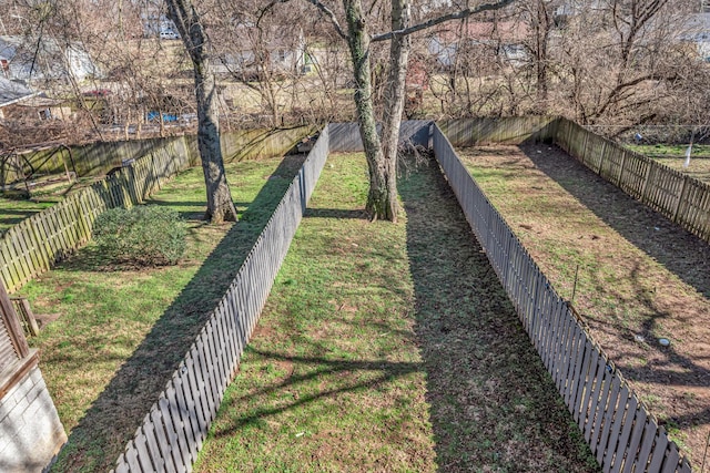 view of yard with a fenced backyard