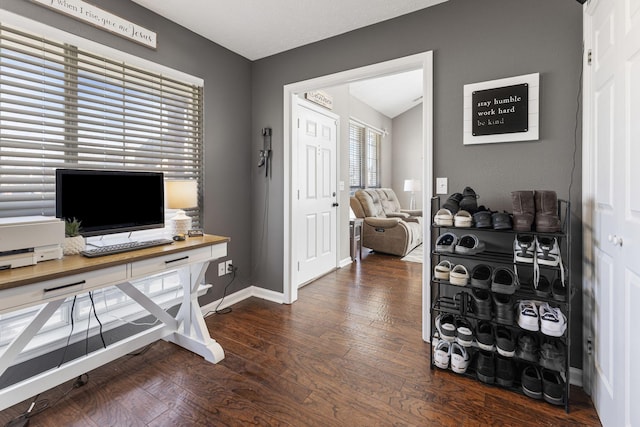 office space with baseboards and wood-type flooring