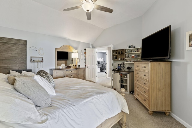 bedroom with baseboards, light colored carpet, ceiling fan, and vaulted ceiling