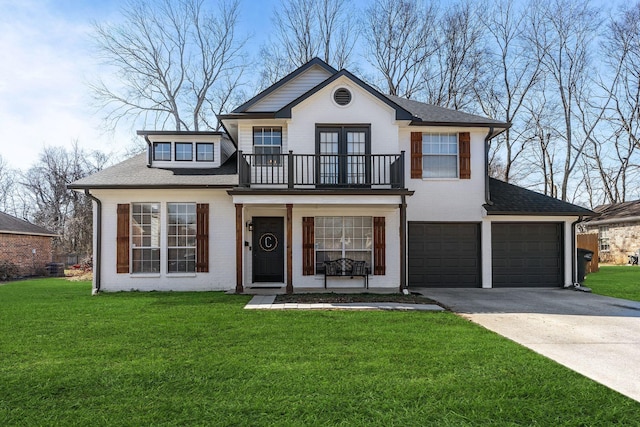 view of front of home featuring a front lawn, a balcony, brick siding, and driveway