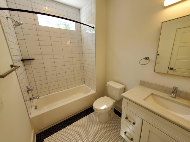 bathroom featuring tile patterned flooring, shower / bathing tub combination, vanity, and toilet