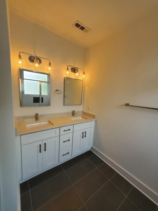 full bathroom with double vanity, visible vents, a sink, and tile patterned floors