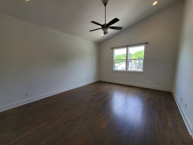 spare room featuring baseboards, a ceiling fan, lofted ceiling, dark wood-type flooring, and recessed lighting