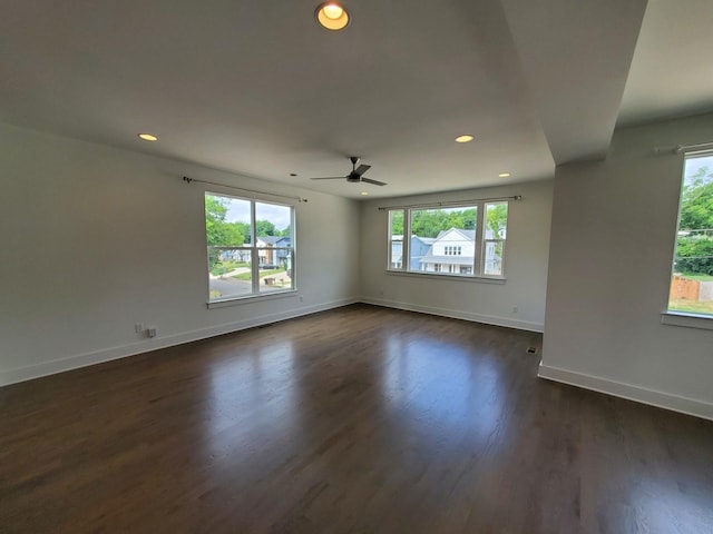 unfurnished room with ceiling fan, baseboards, dark wood-type flooring, and recessed lighting