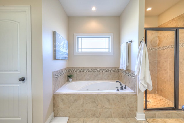 bathroom with a jetted tub, a shower stall, recessed lighting, and tile patterned floors