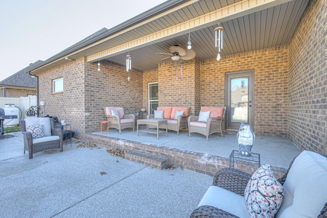 view of patio / terrace featuring a ceiling fan, outdoor lounge area, and fence