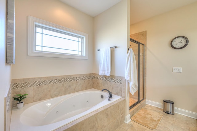 full bath featuring baseboards, a jetted tub, a shower stall, and tile patterned floors