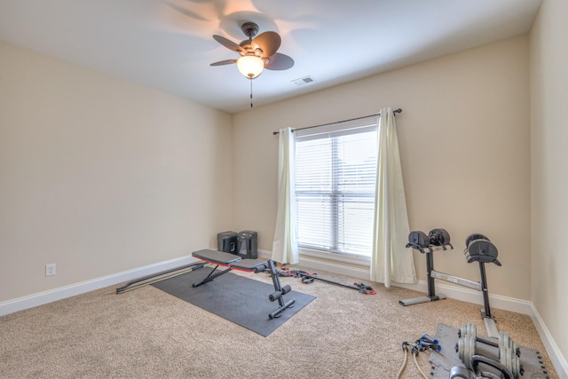 workout area featuring carpet floors, visible vents, ceiling fan, and baseboards