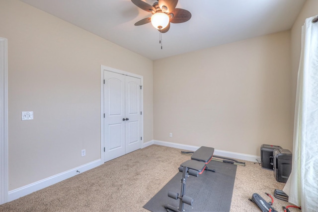 workout area with carpet, baseboards, and ceiling fan