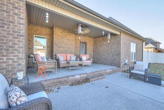 view of patio featuring fence and an outdoor living space