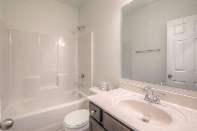 bathroom with toilet, shower / bath combination, and vanity