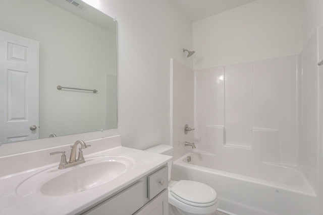 bathroom with  shower combination, visible vents, vanity, and toilet