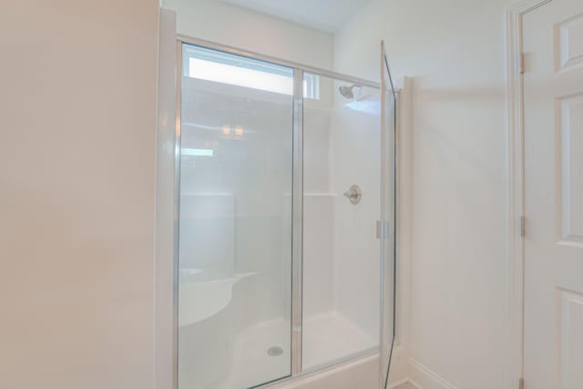 full bathroom featuring a stall shower