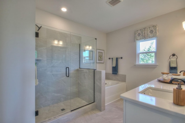 full bathroom featuring a stall shower, visible vents, a bath, and vanity