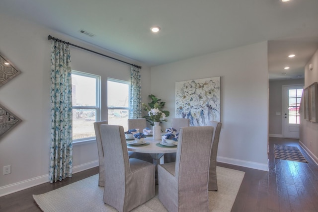 dining space with recessed lighting, visible vents, baseboards, and wood finished floors