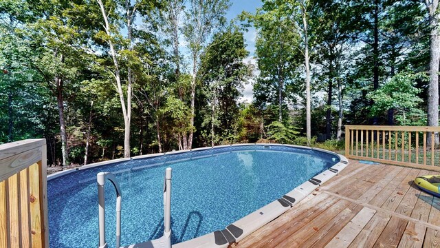 outdoor pool featuring a deck