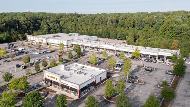 birds eye view of property with a wooded view