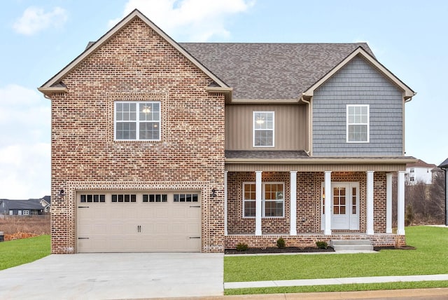 view of front of property with brick siding, an attached garage, concrete driveway, and a front yard