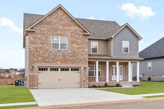 view of front facade with brick siding, an attached garage, a front lawn, central AC, and driveway