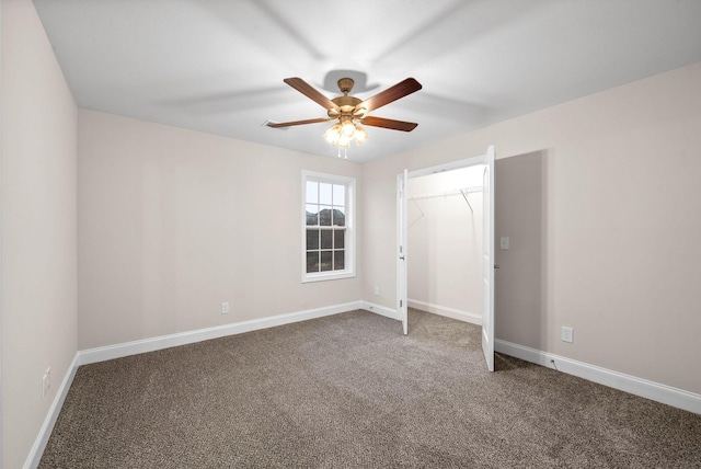 unfurnished bedroom with baseboards, carpet floors, a closet, and a ceiling fan