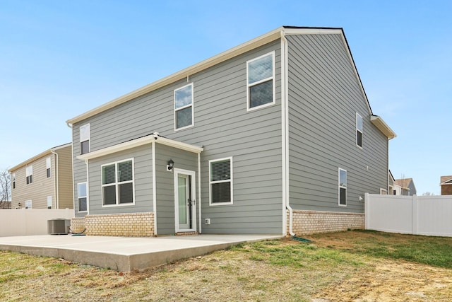 rear view of house featuring central air condition unit, a patio area, and fence